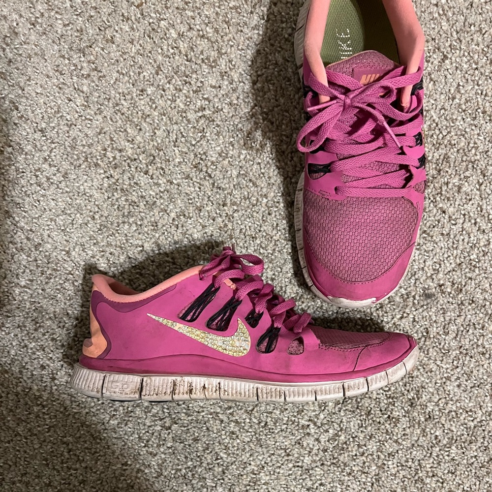 Nike shoes. Size 9. Missing some of the rhinestones on the side.